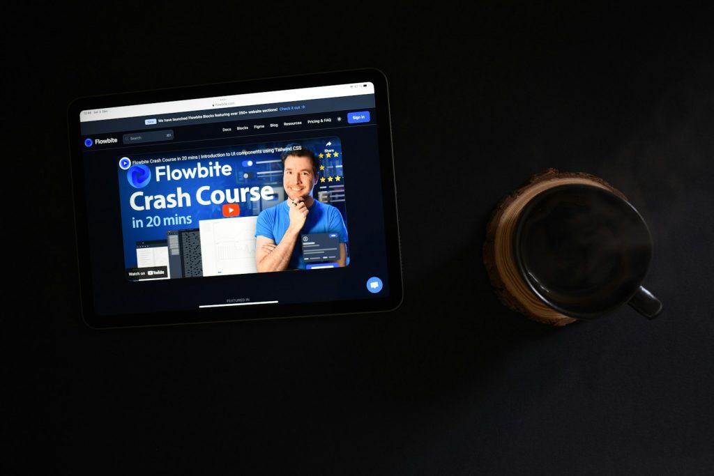 a tablet and a coin